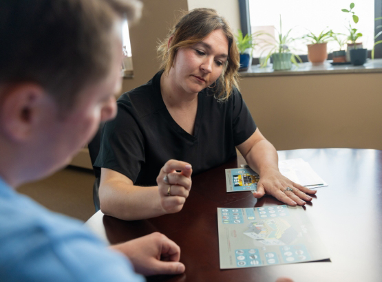 Mesothelioma Advocate Morgan Grebing, RN, discussing support with a client caregiver